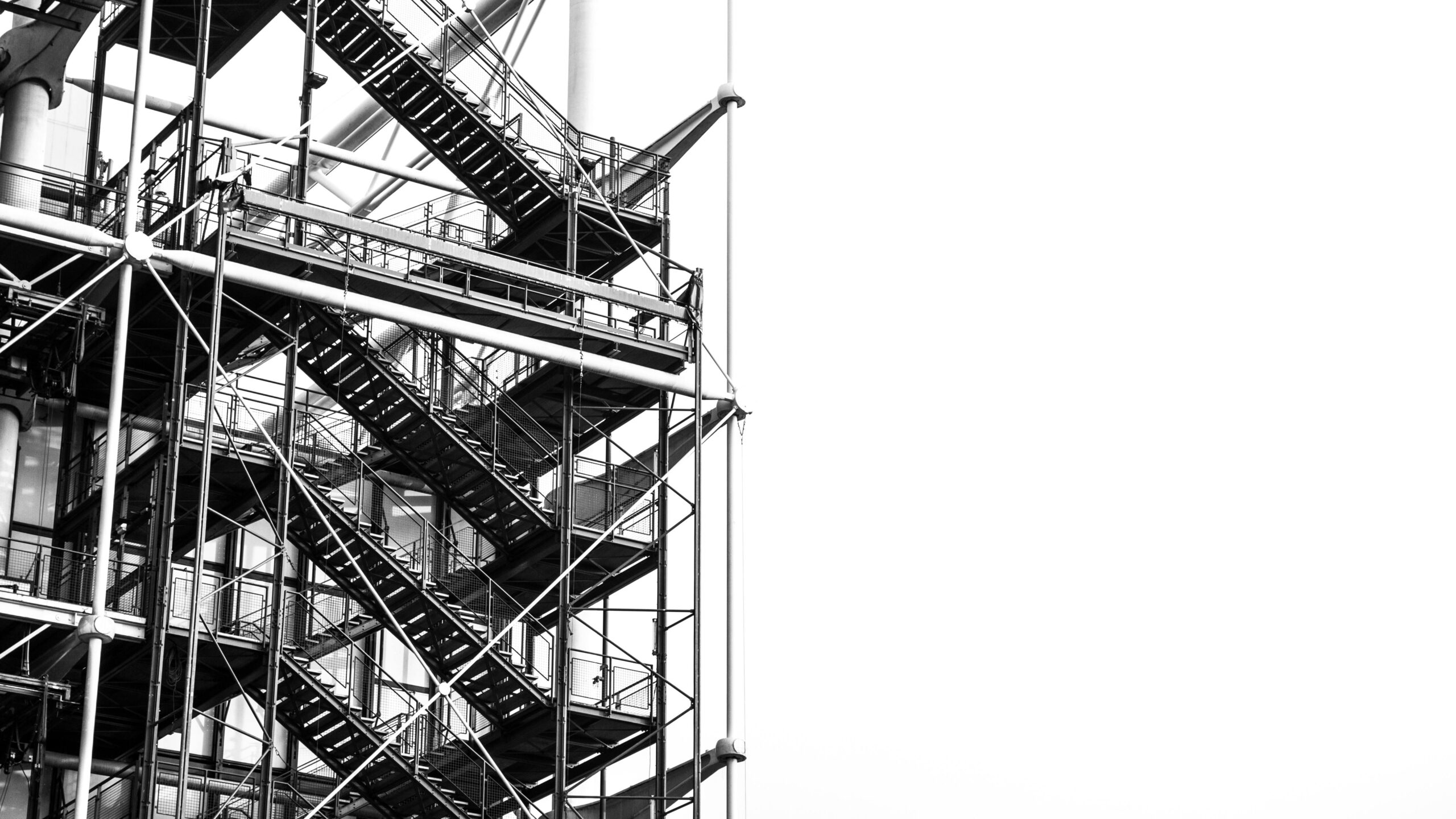 A striking black and white image of industrial stairs at Pompidou Center, Paris.